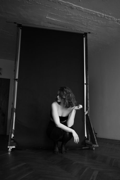 Free Elegant black and white portrait of a woman posing in a studio setting. Stock Photo