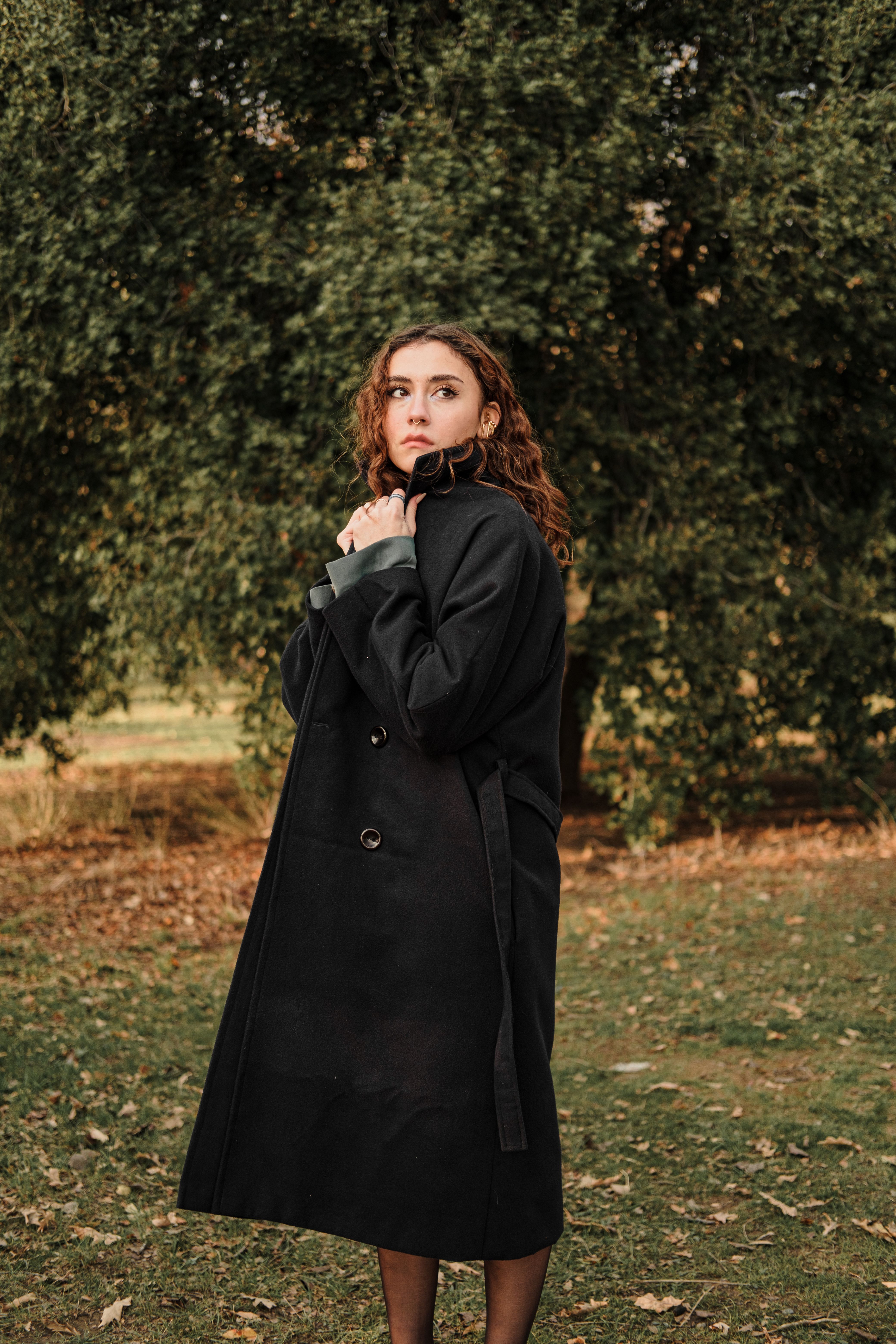 Woman Wearing Trench Coat on a Street · Free Stock Photo