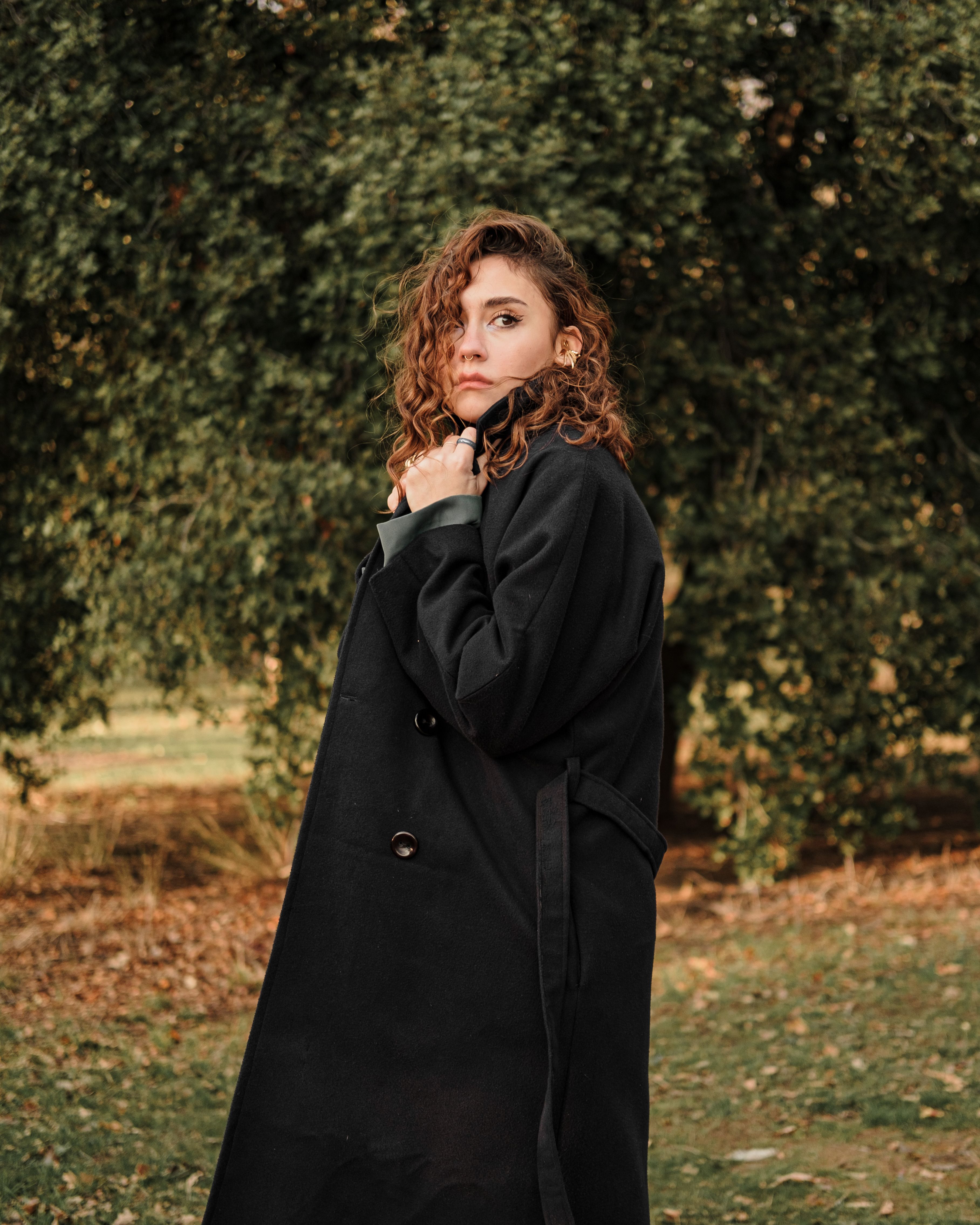 Woman Wearing Trench Coat on a Street · Free Stock Photo