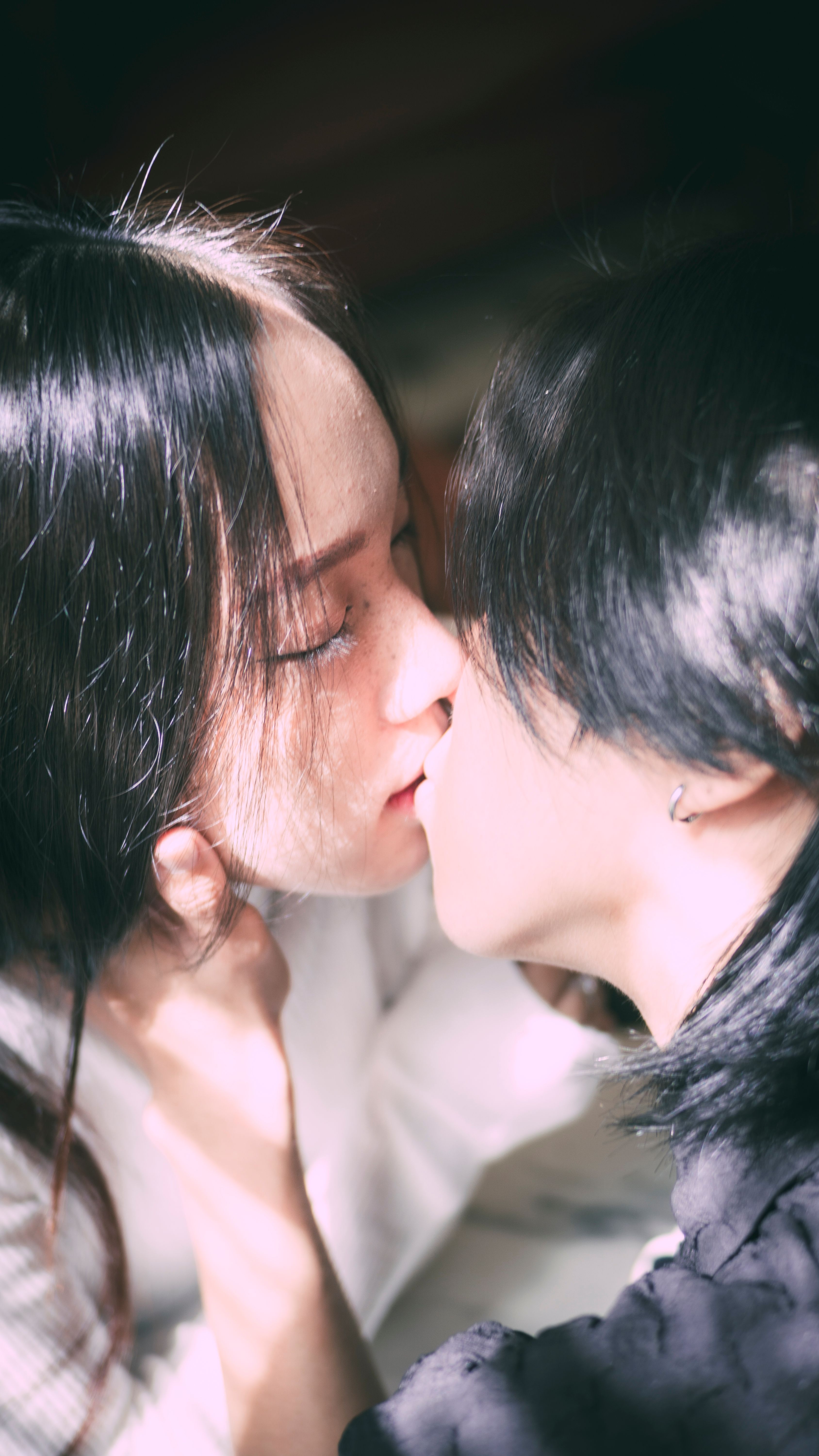 A Couple Kissing With Their Eyes Closed