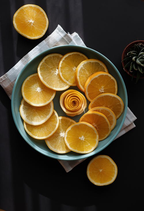 Orange Slices and Flower on Plate