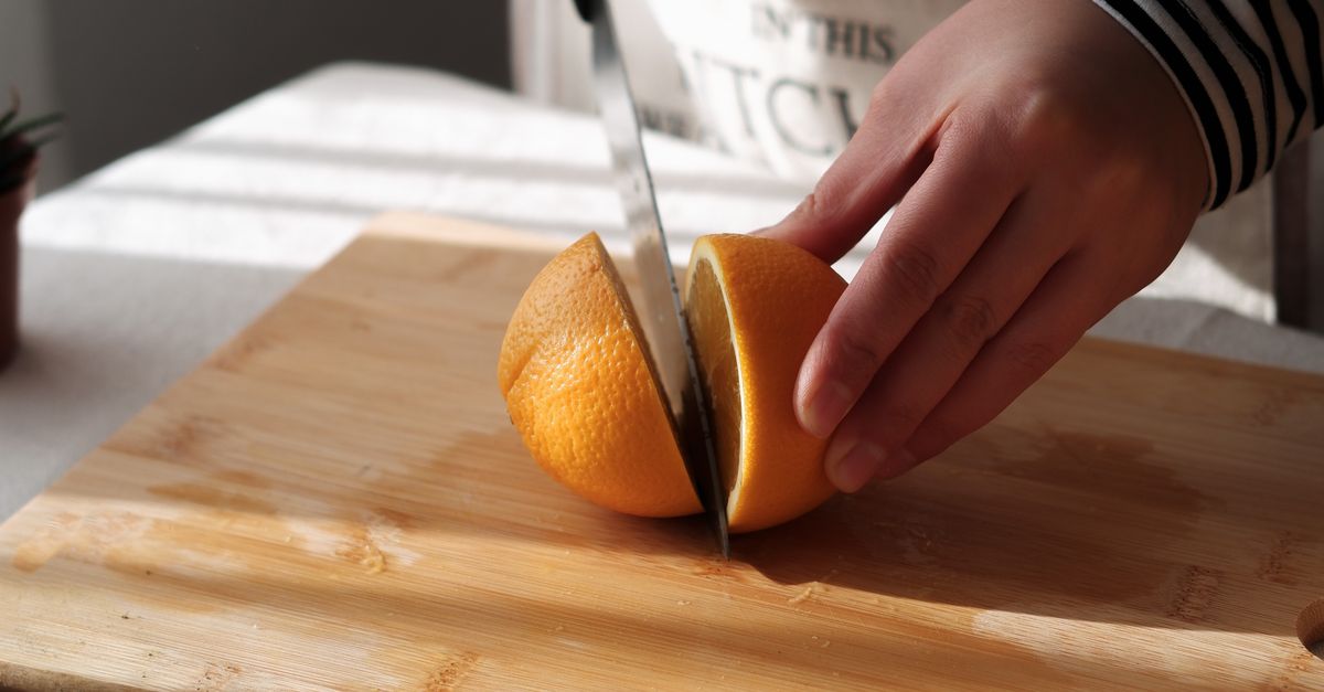 Close up of Cutting Orange · Free Stock Photo