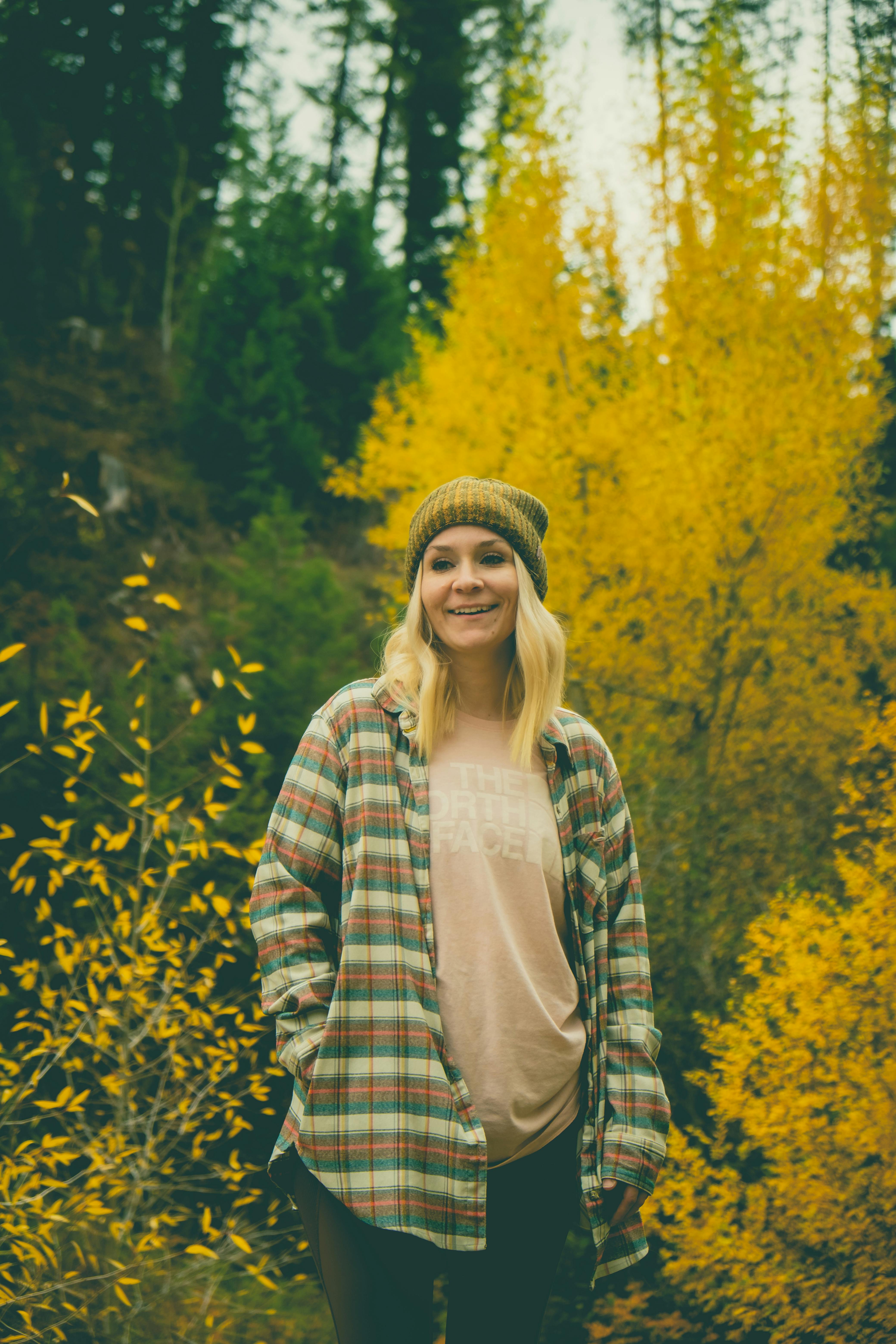 woman standing near the autumn plants