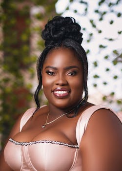 Stylish portrait of a black woman in a natural setting in Ghana, showcasing beauty and confidence.