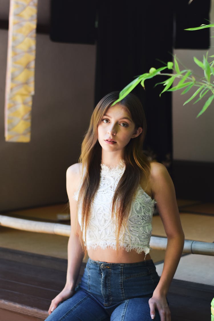 Model In Embroided Blouse And Jeans