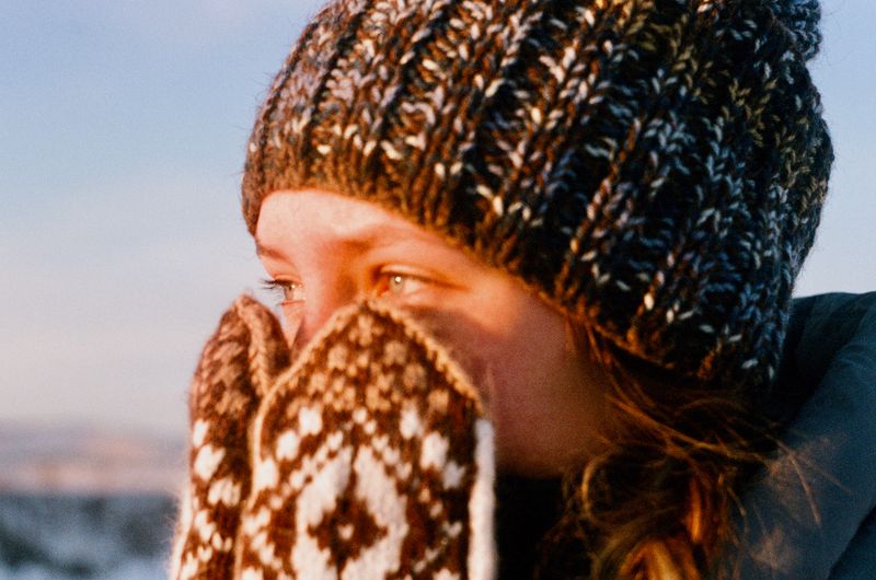 Woman wearing a knitted beanie in winter