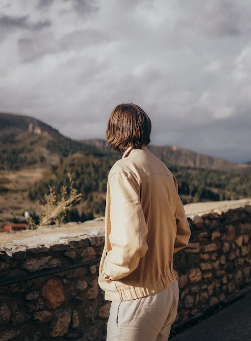 Back View of a Person Wearing Brown Jacket 
