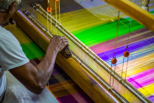 Man Weaving Silk