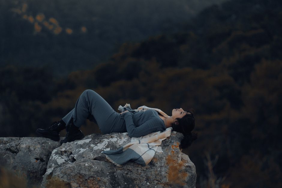 A person finding peace in nature while reflecting on their journey - grief treatment A person finding peace in nature while reflecting on their journey - grief treatment