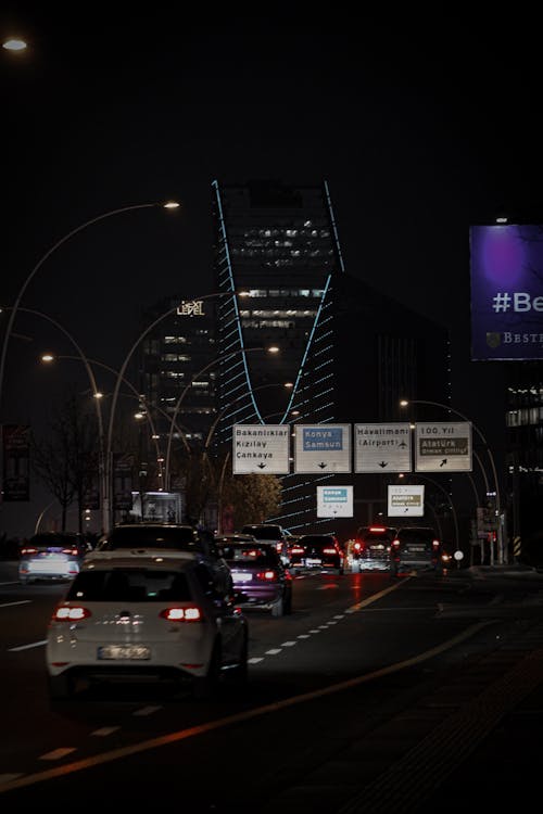 Back View Shot of Moving Cars on the Road During Night Time