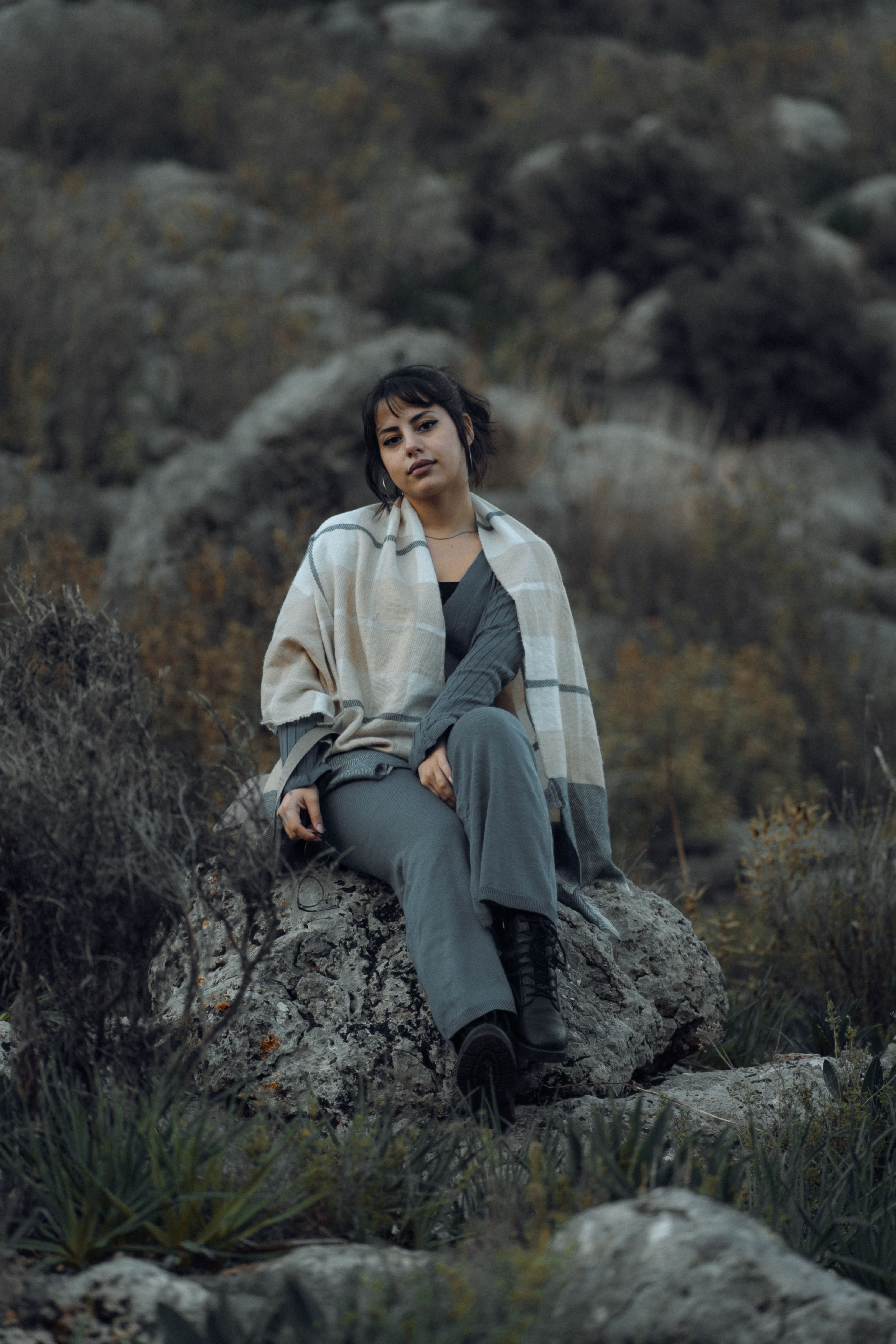 Woman Sitting on a Rock in the Mountain Side · Free Stock Photo