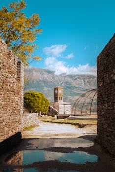 Beautiful view of Gjirokaster Castle in Albania with mountains in the background.