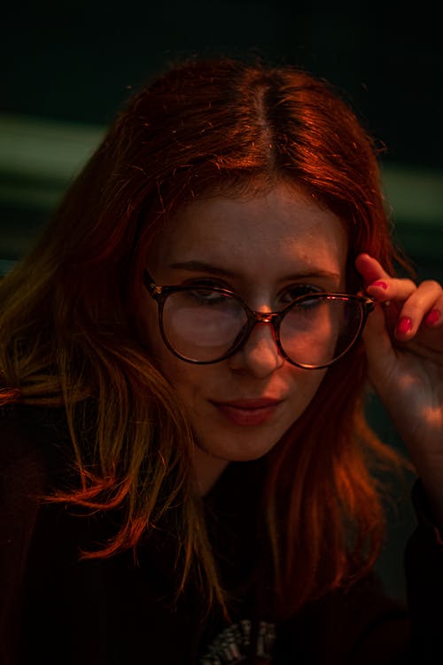 Woman with Red Hair wearing Eyeglasses