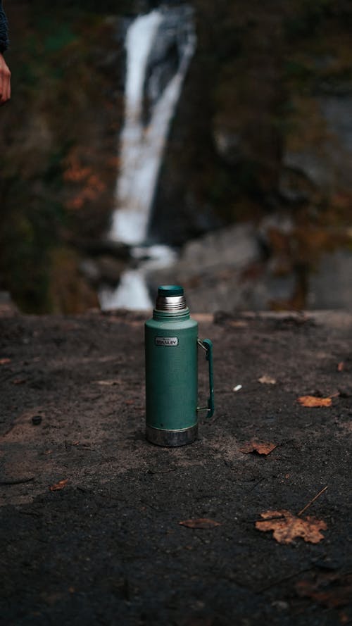 Green Thermos on the Ground