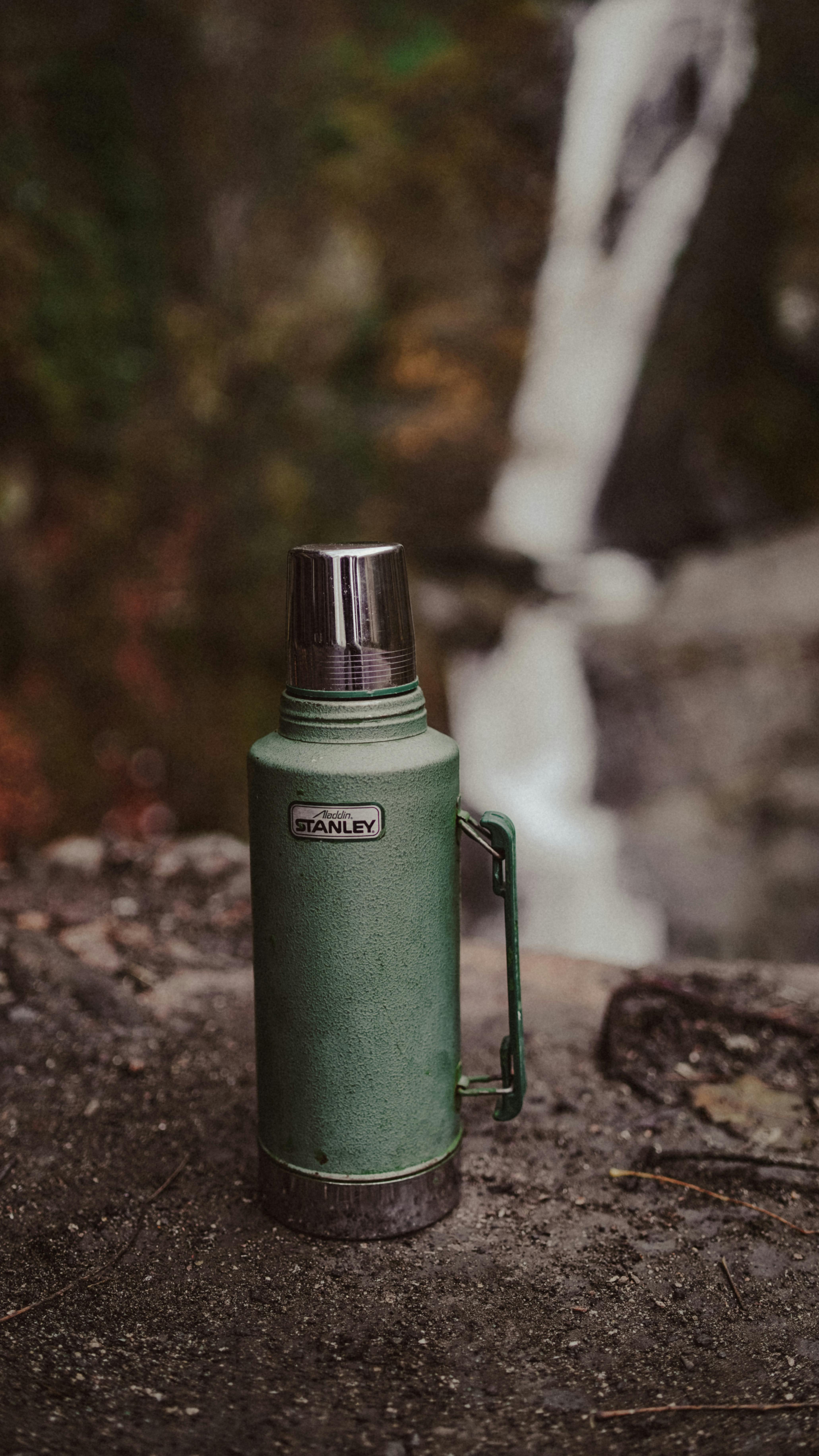 bottle on rock in forest