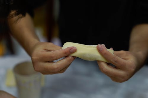 A Person Holding a Dumpling Wrapper