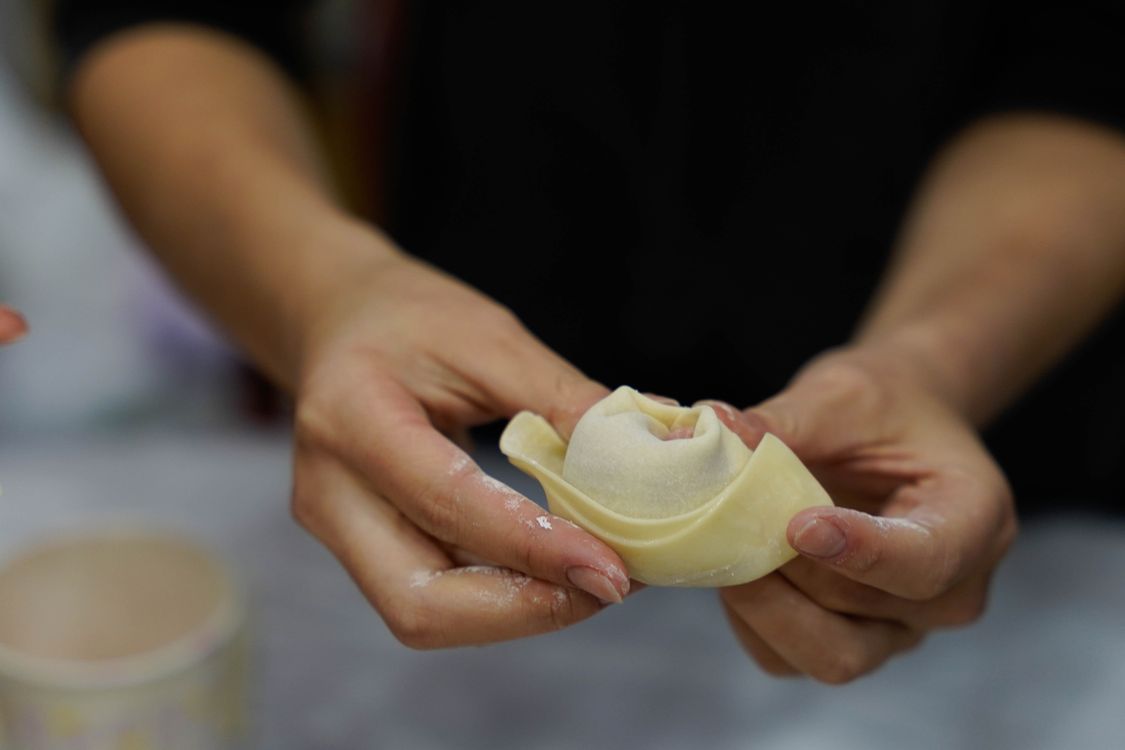 Dumpling Hand A Person Holding a Dumpling · Free Stock Photo