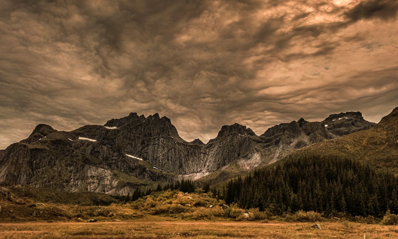 a breathtaking view of the lofoten mountains under a dramatic sky duri