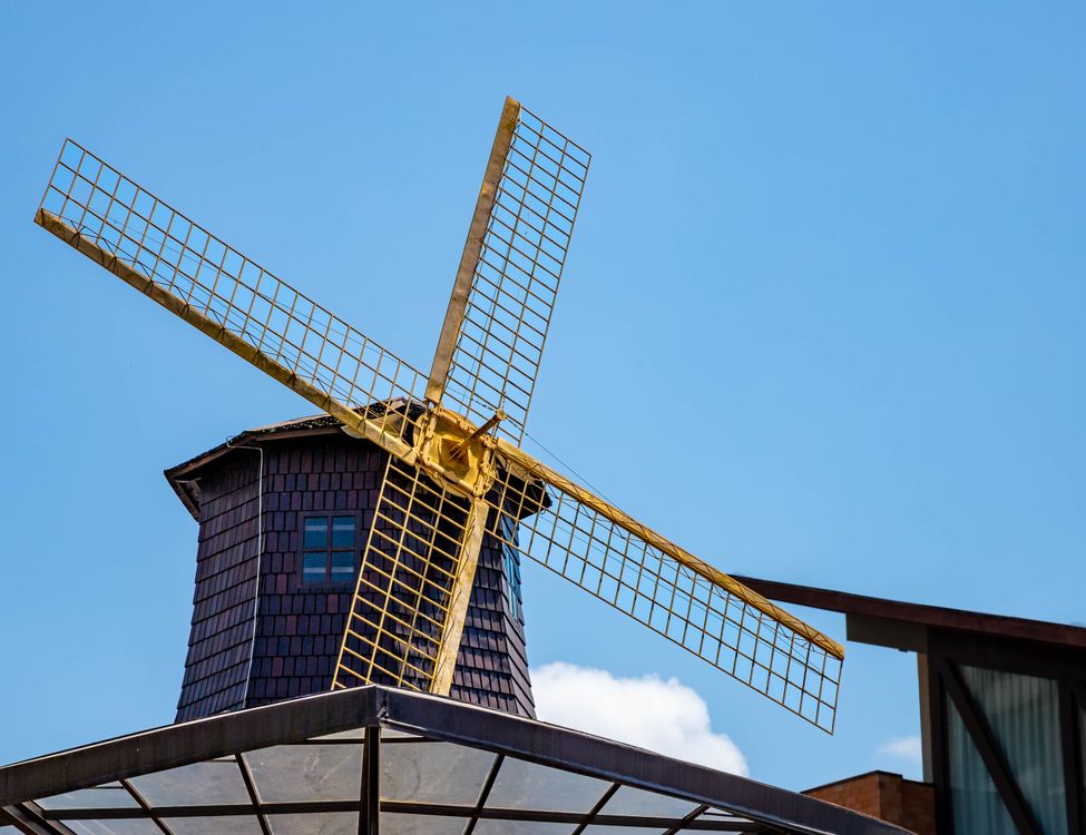A Yellow Windmill Against the Blue Sky · Free Stock Photo