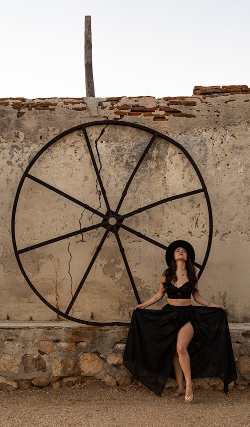 Woman in Black Skirt and Hat