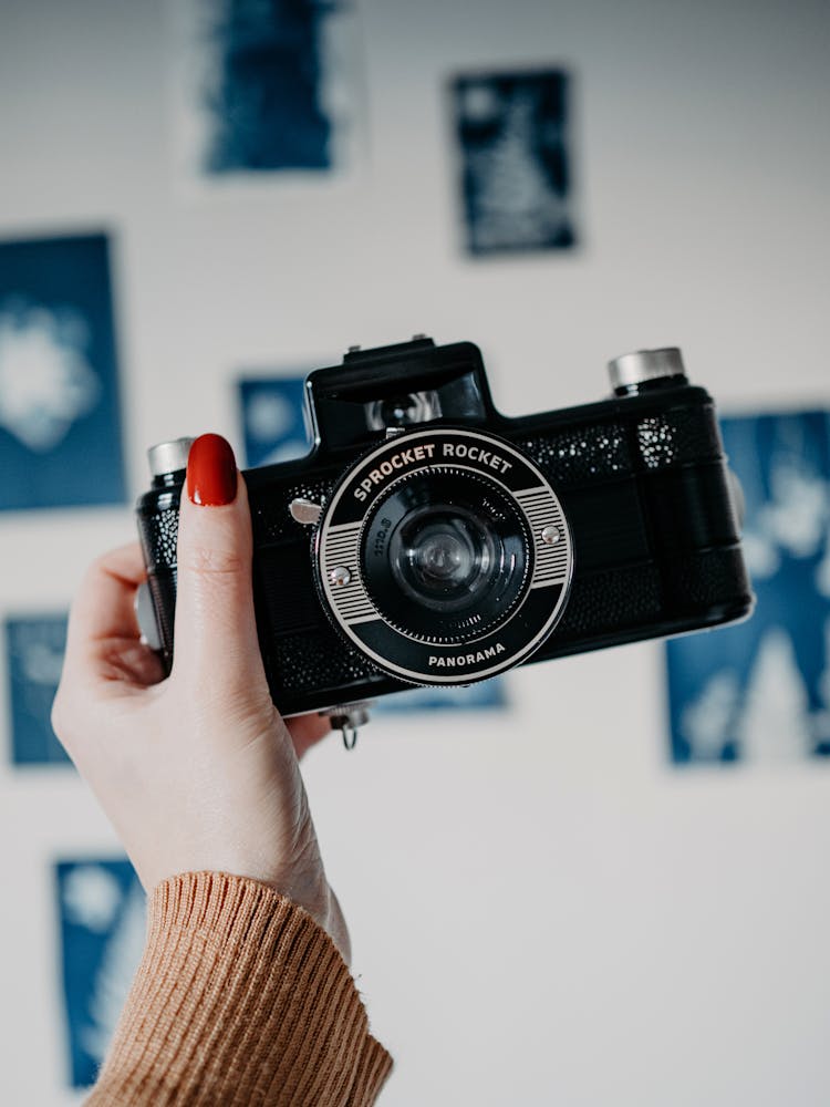 Hand Holding Analogue Camera