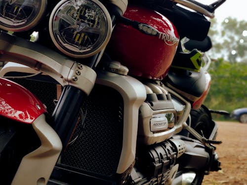 Close Up Photo of a Red Triumph Motorbike