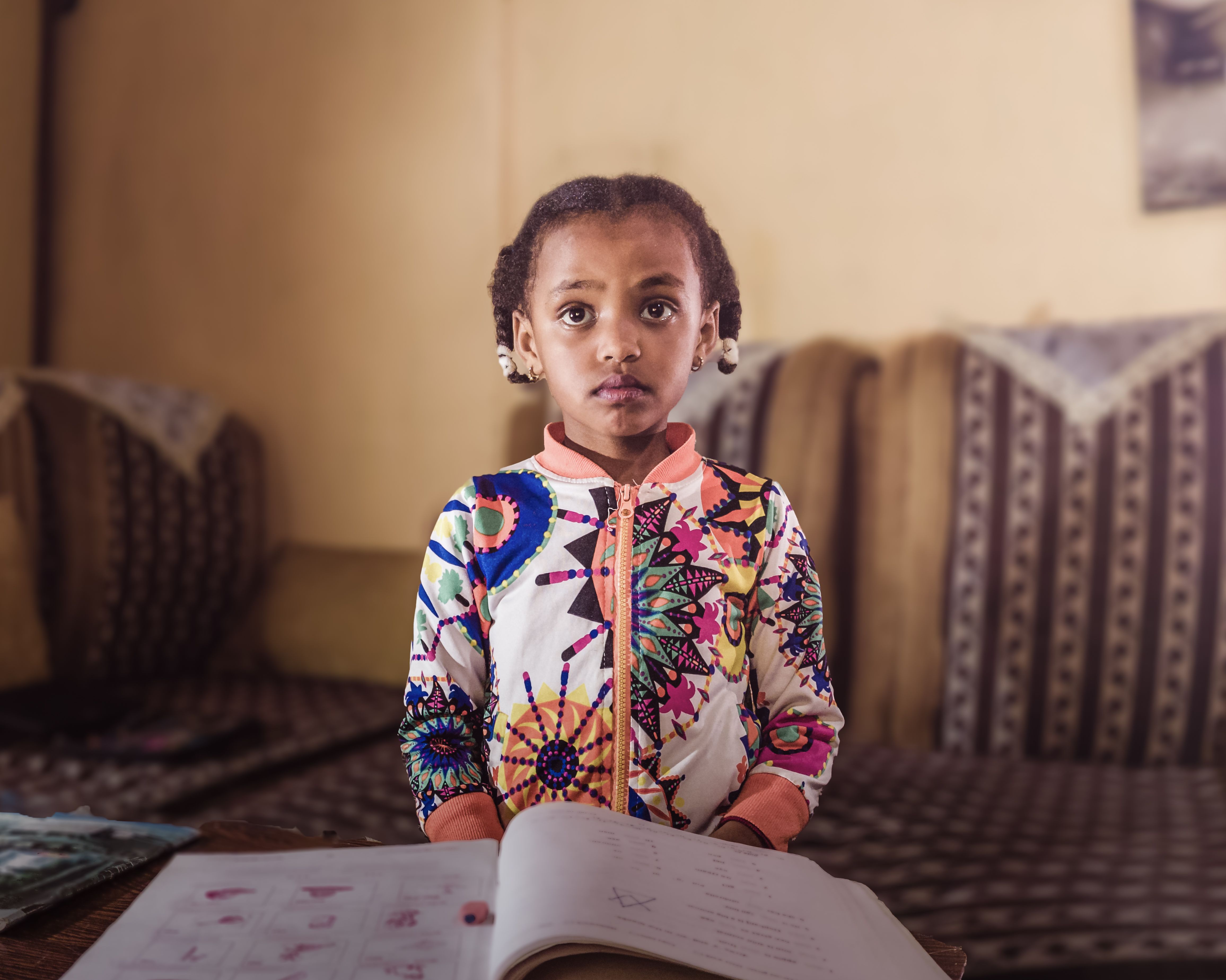 Young student concentrating on financial literacy exercises