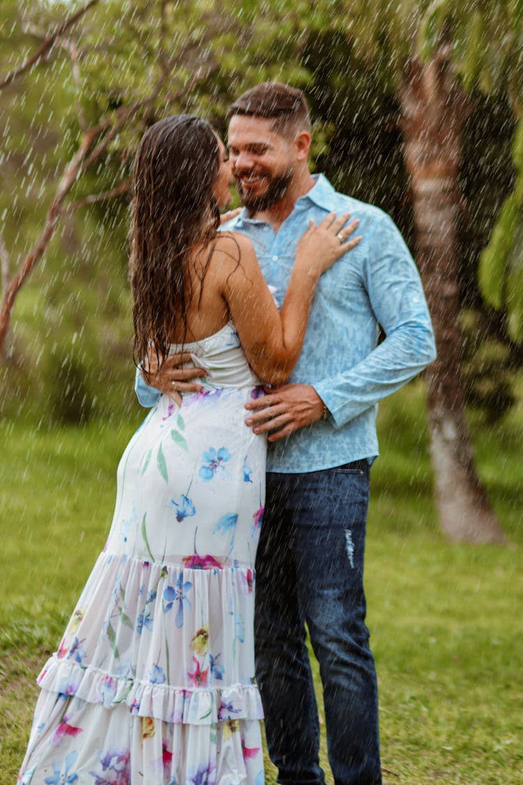 Couple Kissing Under The Raining