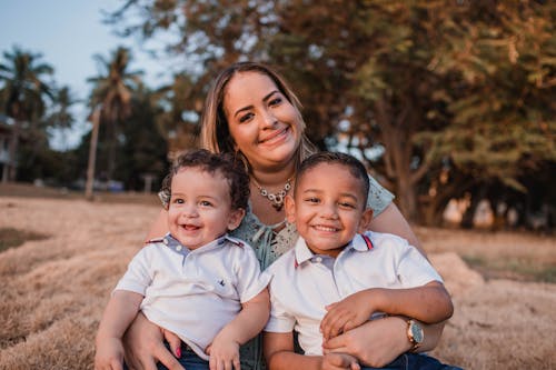 Woman Holding Two Boys