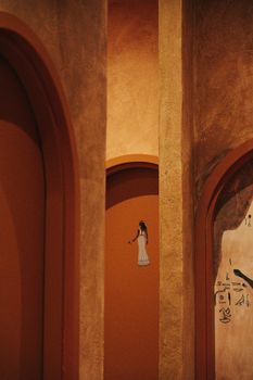 Intricate Egyptian arched doorways with symbolic motifs in warm tones.