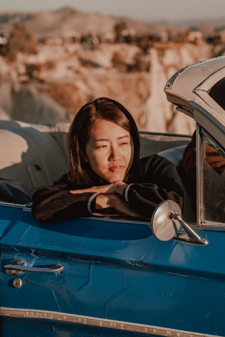 Asian Woman Relaxing In Car