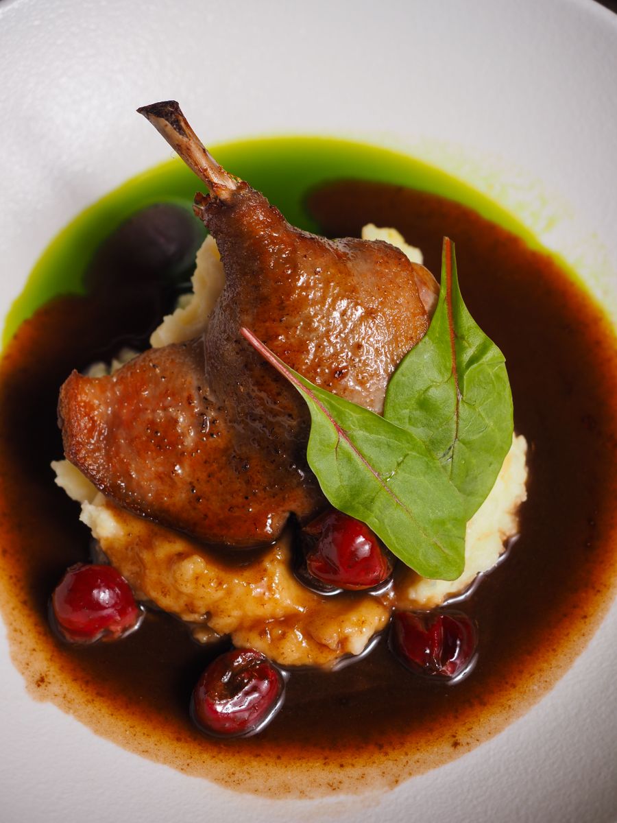 Duck confit with cherries and a dark jus