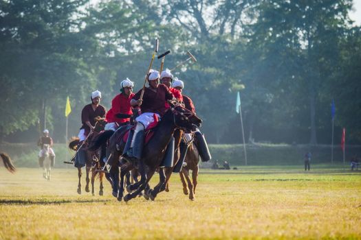 Dynamic scene of a thrilling polo match in Imphal, India, capturing the energy of the sport.