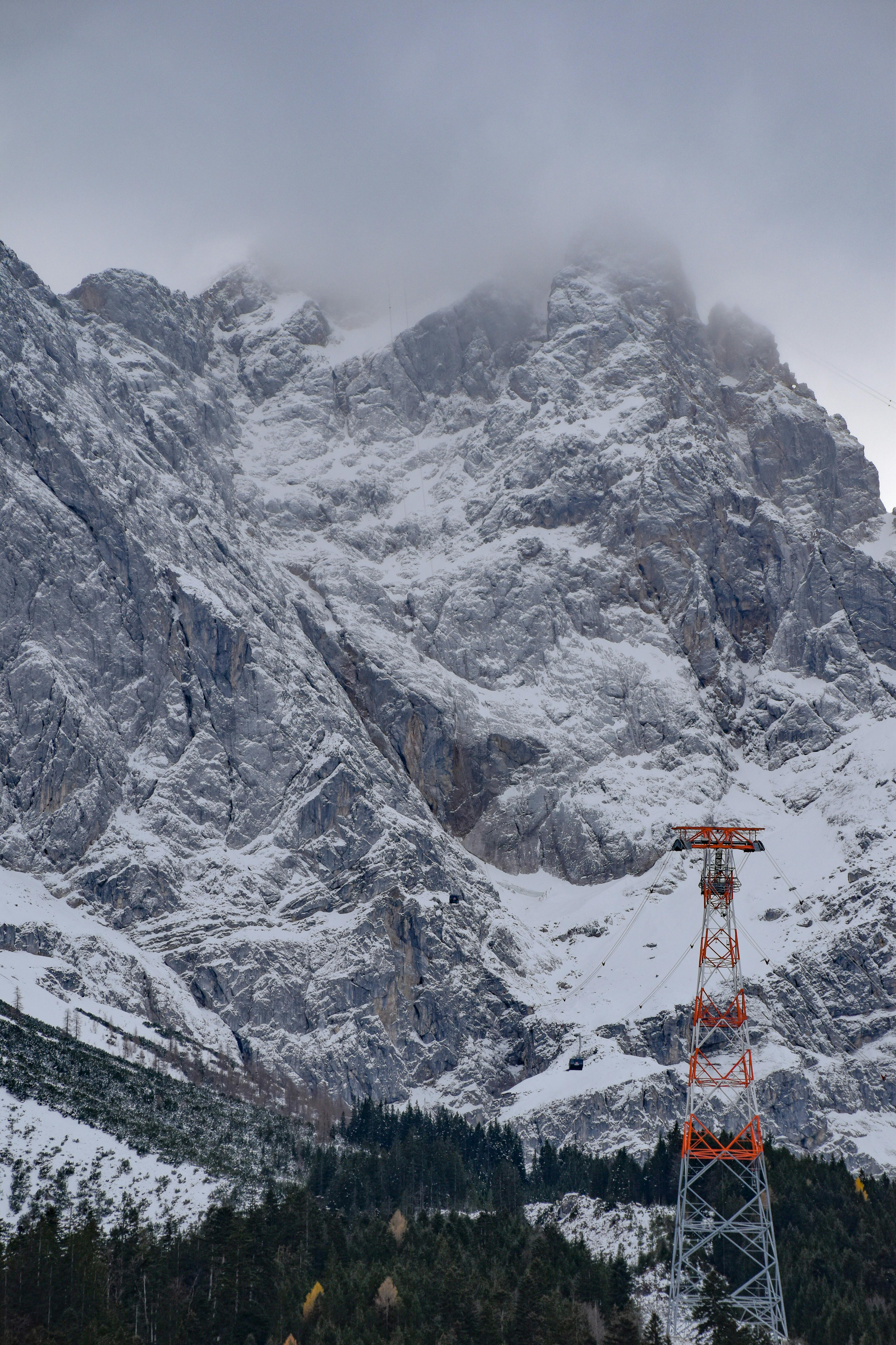 Prescription Goggle Inserts - Snow-covered mountain scene with cloudy sky and a tower, capturing the alpine winter atmosphere.