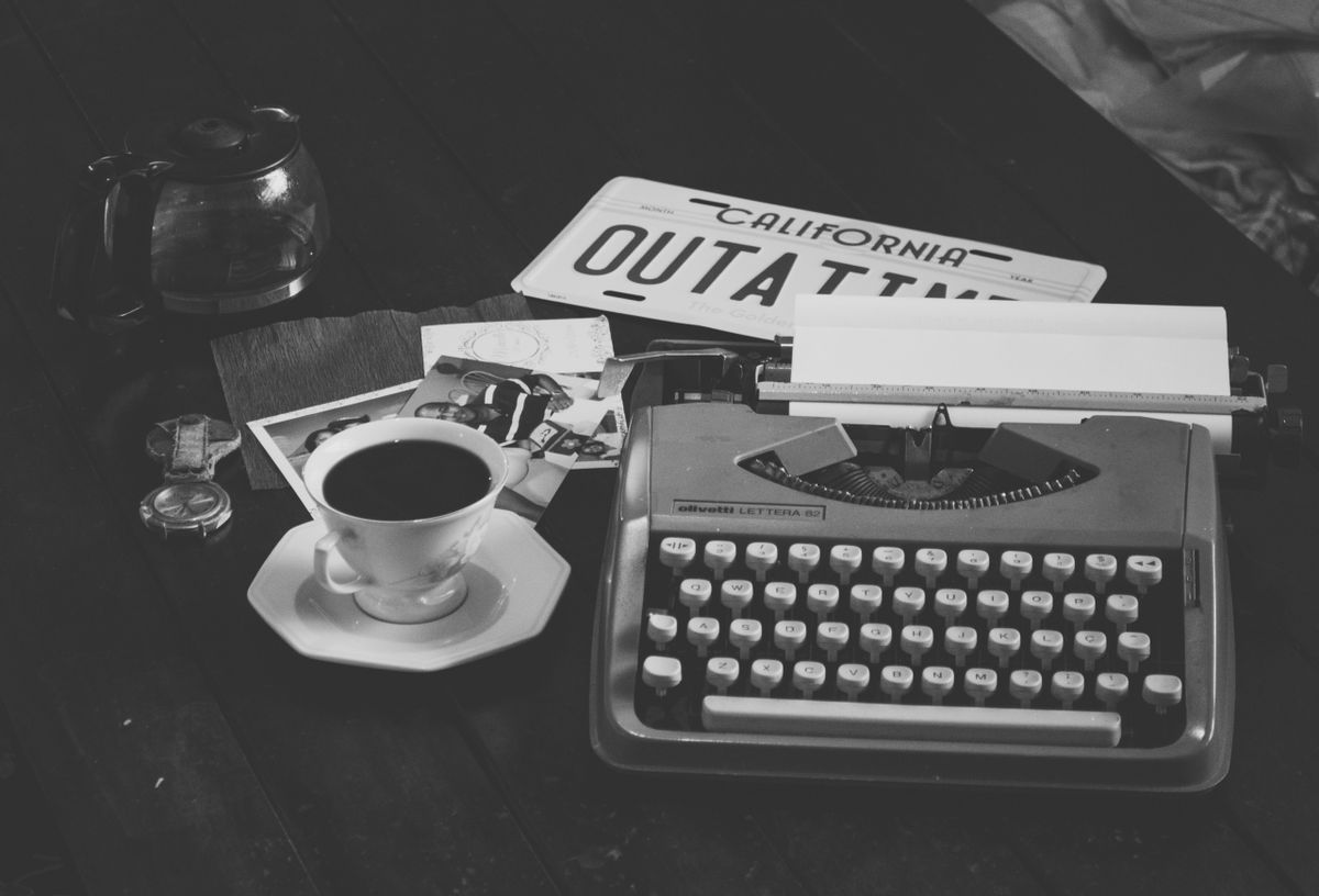 Coffee and a vintage typewriter — writing tools change, writing craft does not