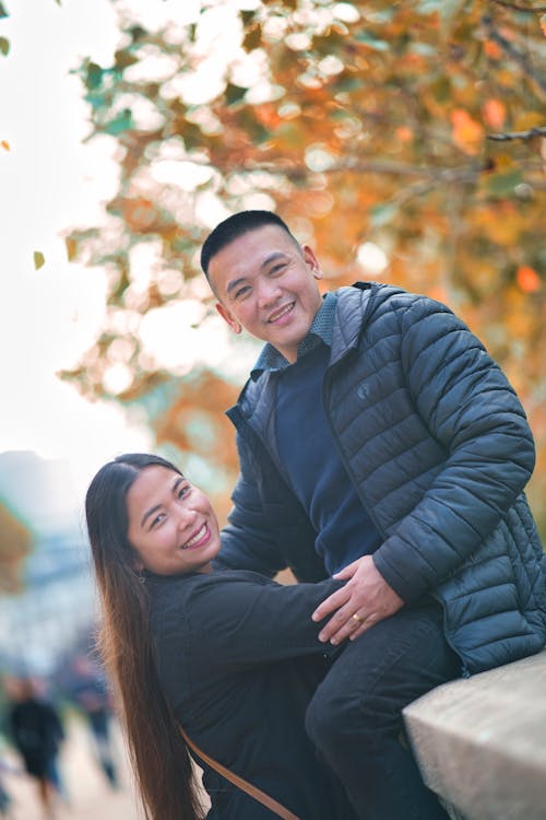 Couple Posing Together in a Park in Autumn
