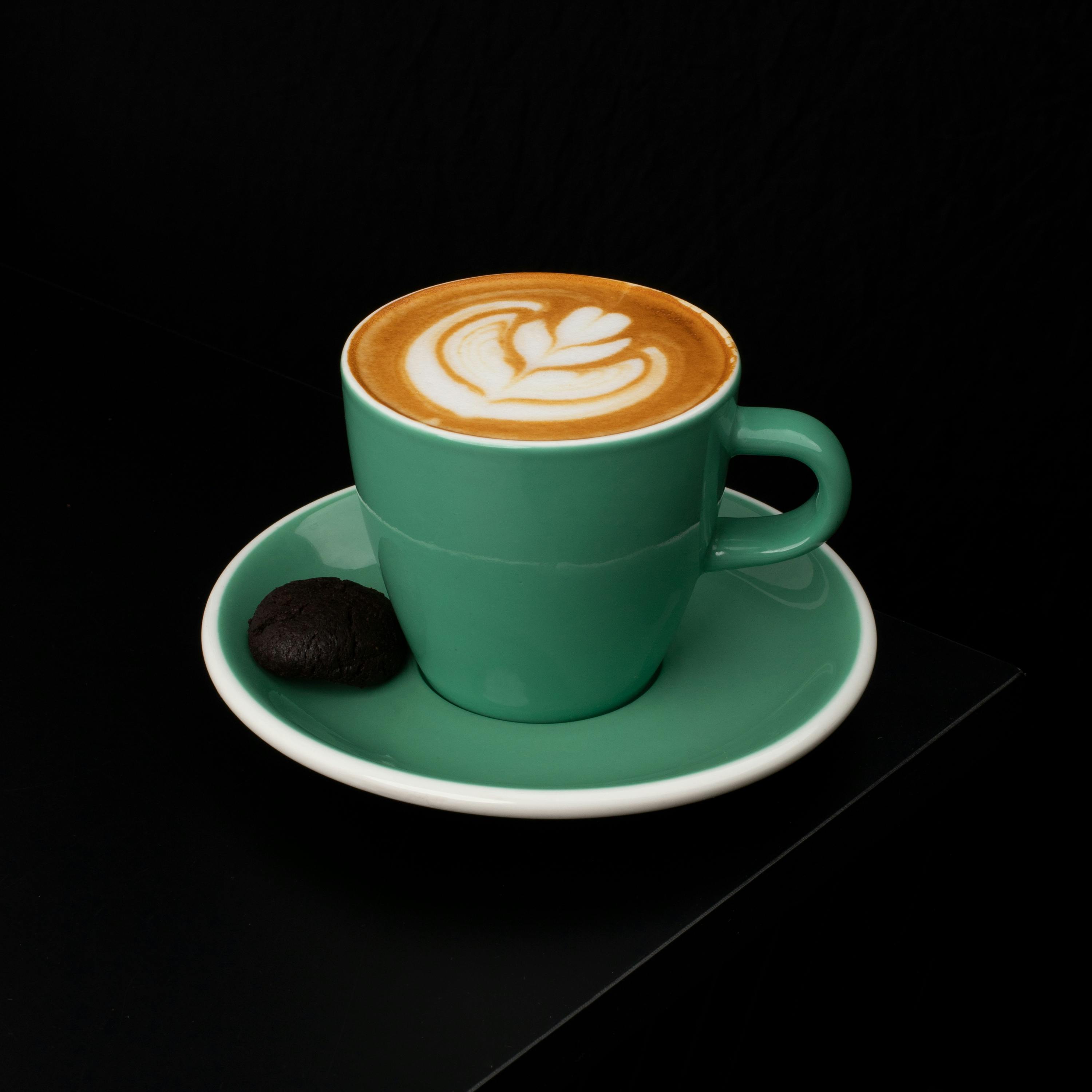 A Cortado Drink with Latte Art on Green Ceramic Cup · Free Stock Photo