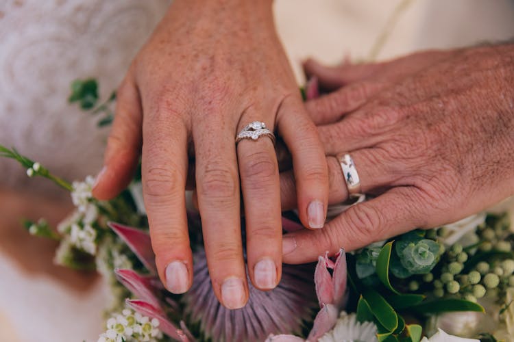 Touching Hands With Wedding Rings