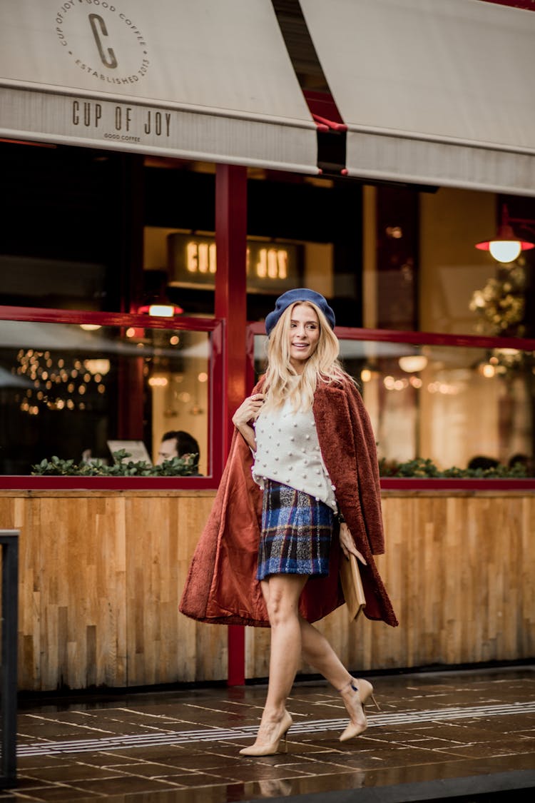 Stylish Woman Walking On Sidewalk