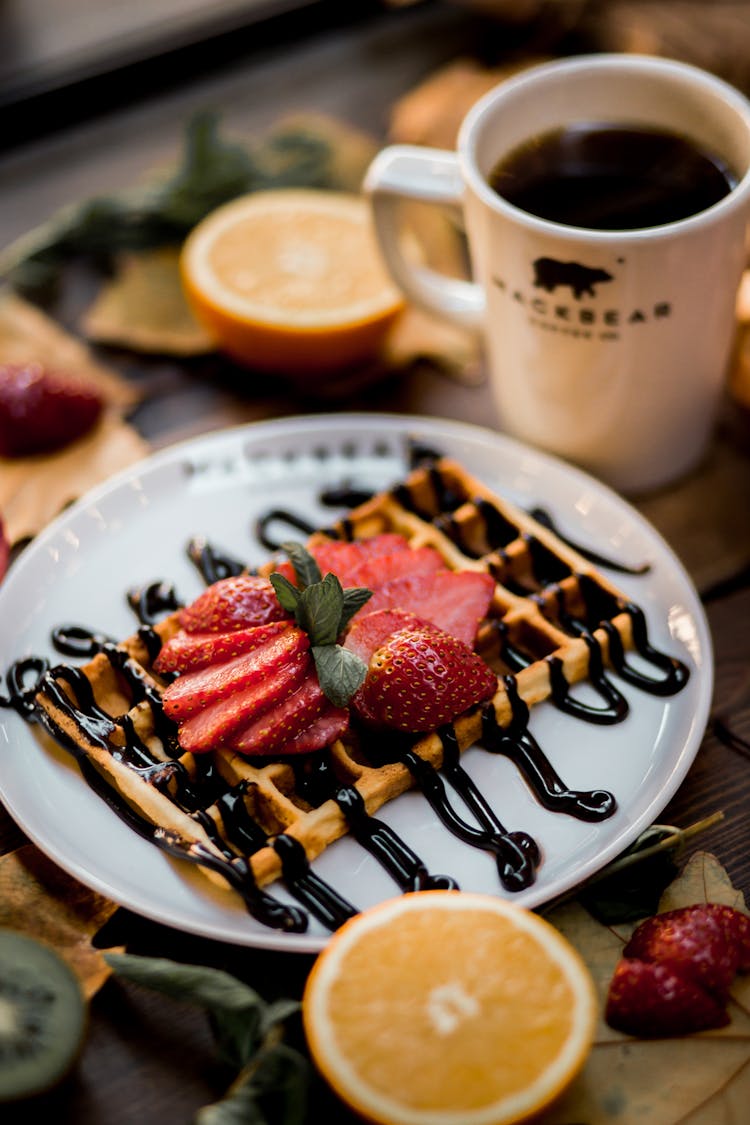 Waffle On Plate And Fruits Around