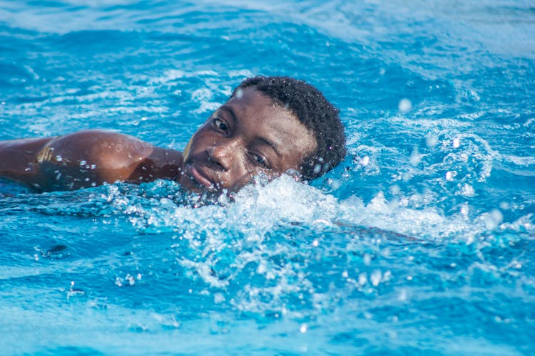 Man Swimming On Pool 