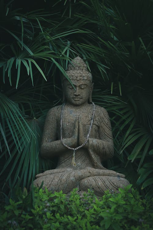 Photo of a Buddha Sculpture in the Garden · Free Stock Photo
