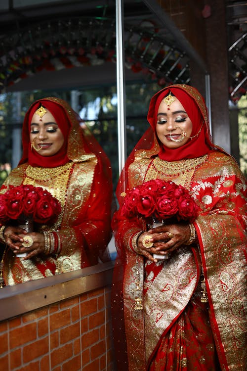 Bride Wearing Traditional Clothing Reflected in Mirror