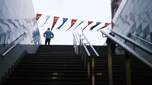 Man on Steps in City