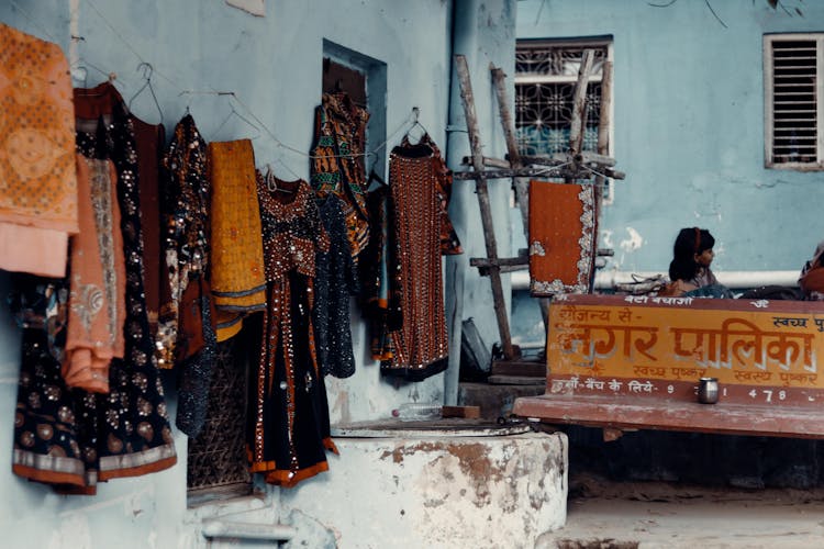 Photo Of Dresses Hanging On A Wall In India