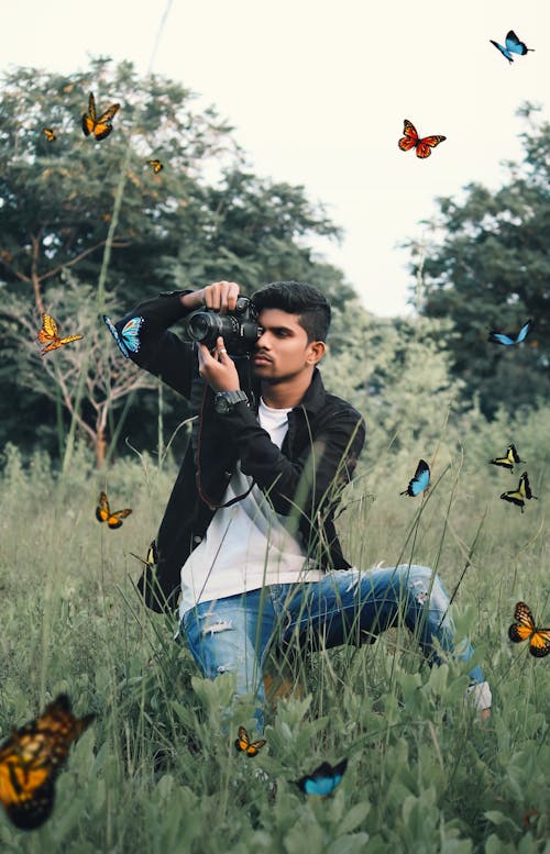 Photographer Clicking Butterflies Photos