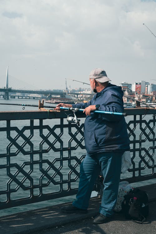 ayakta, Balık tutmak, boş zaman içeren Ücretsiz stok fotoğraf