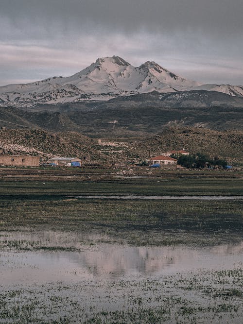 Free Houses in Mountain Foot Valley Stock Photo