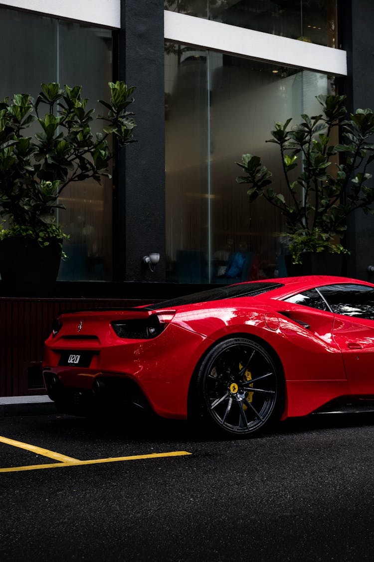 A Red Luxury Car Parked On The Street