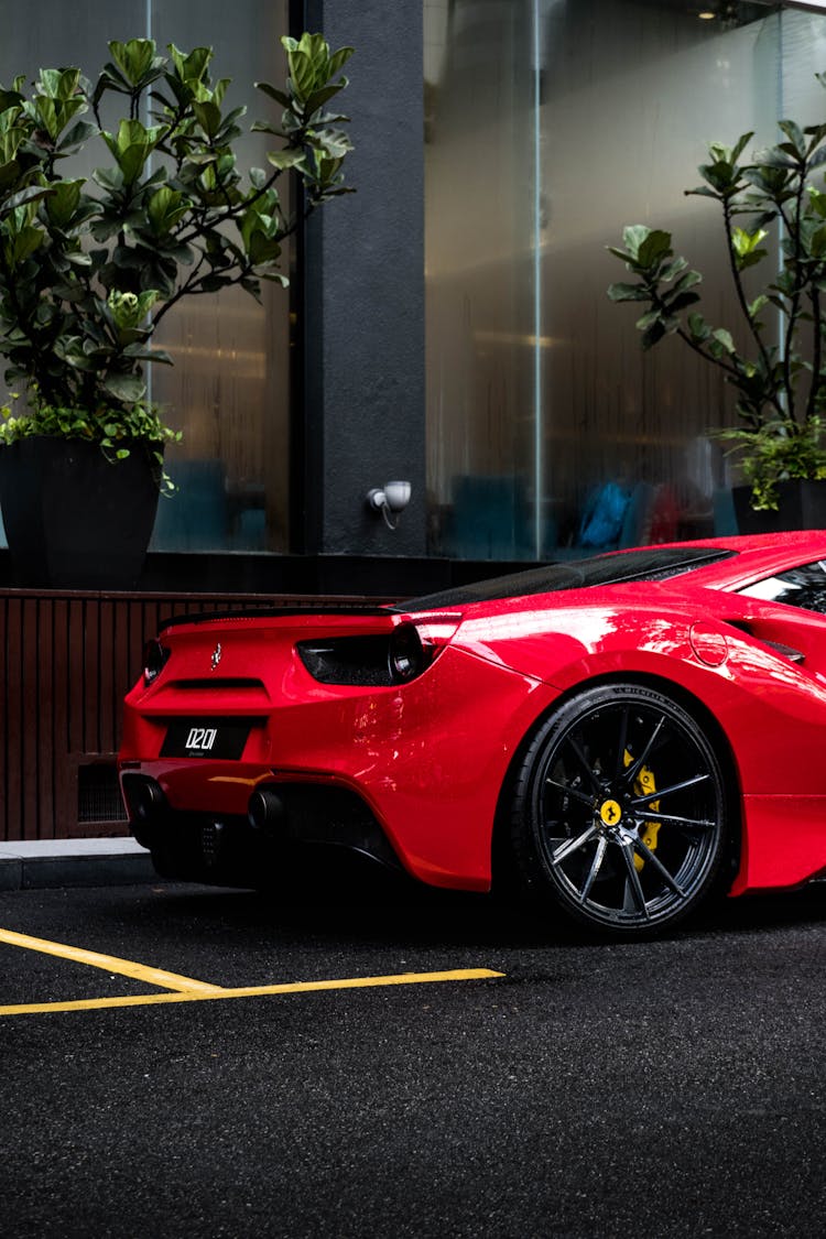 A Red Luxury Car Parked On The Street